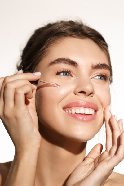 Beauty,And,Skincare,Concept.,Smiling,Woman,Applying,Argan,Oil,Essential,